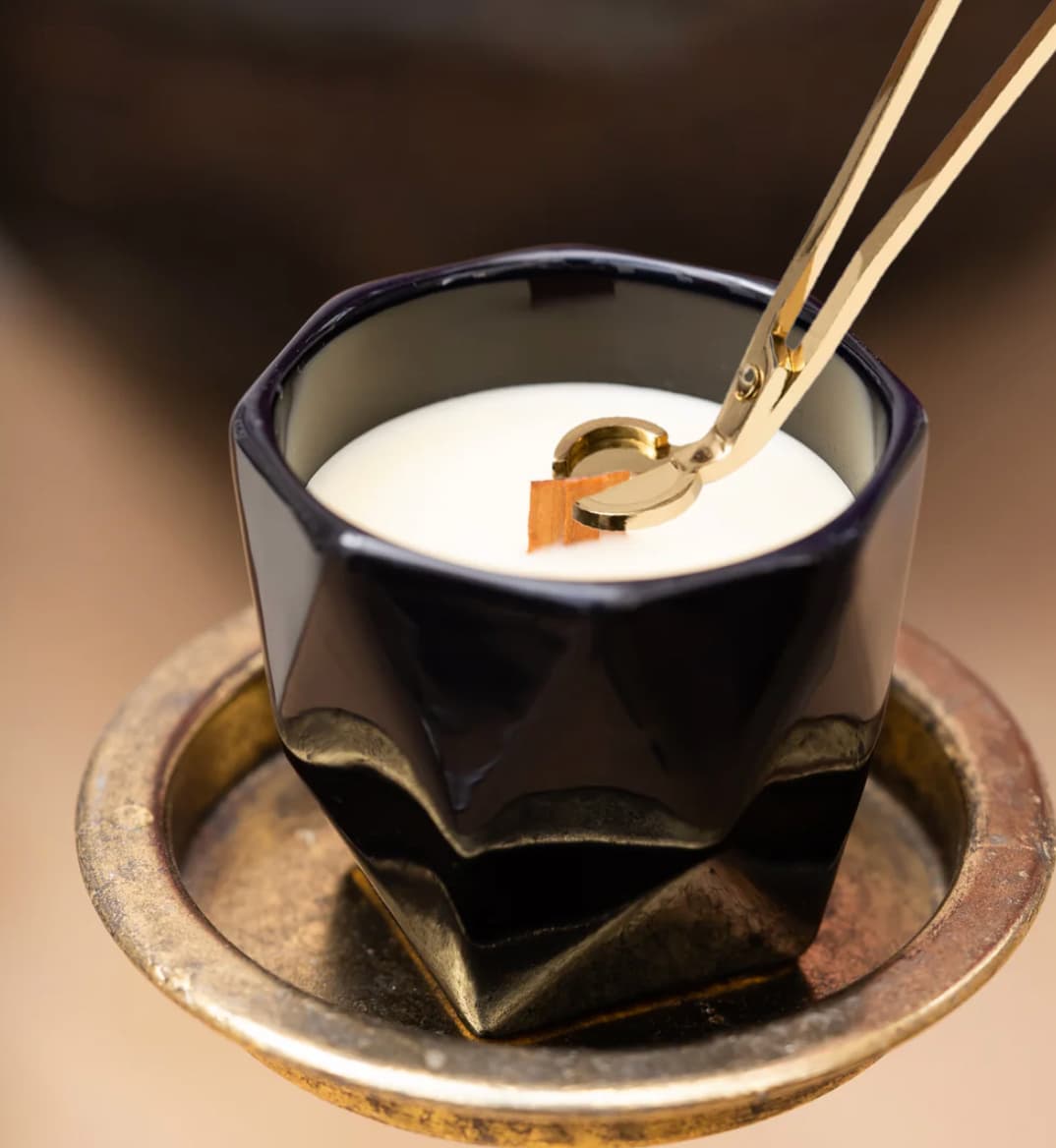 Maison Monson candle ritual with gold accessories